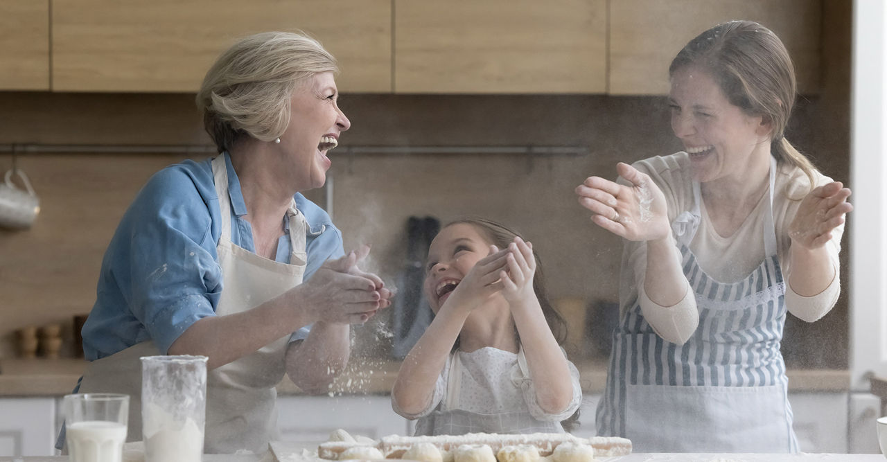 light wood and painted black tri-toned kitchen cabinetry 